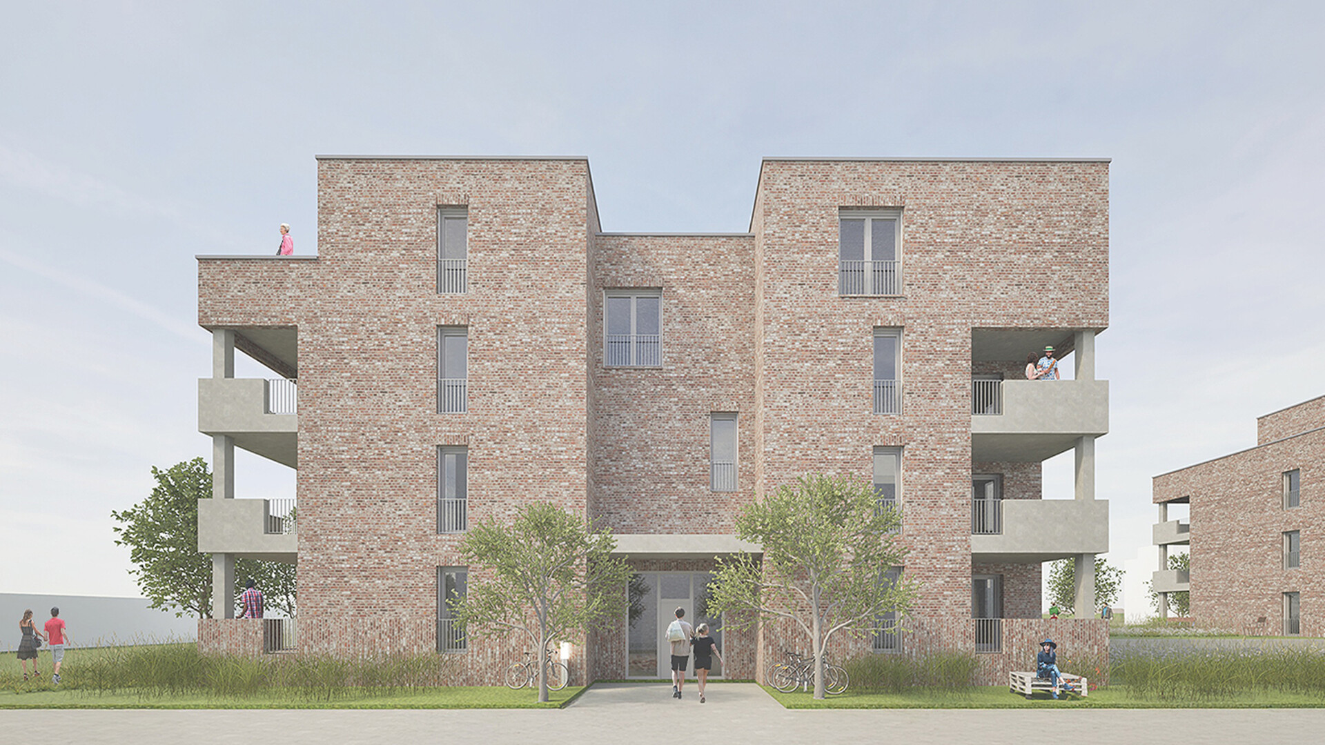 Ansicht eines kubistischen Mehrfamilienhauses mit Klinkerfassade und Balkonen an den Ecken.