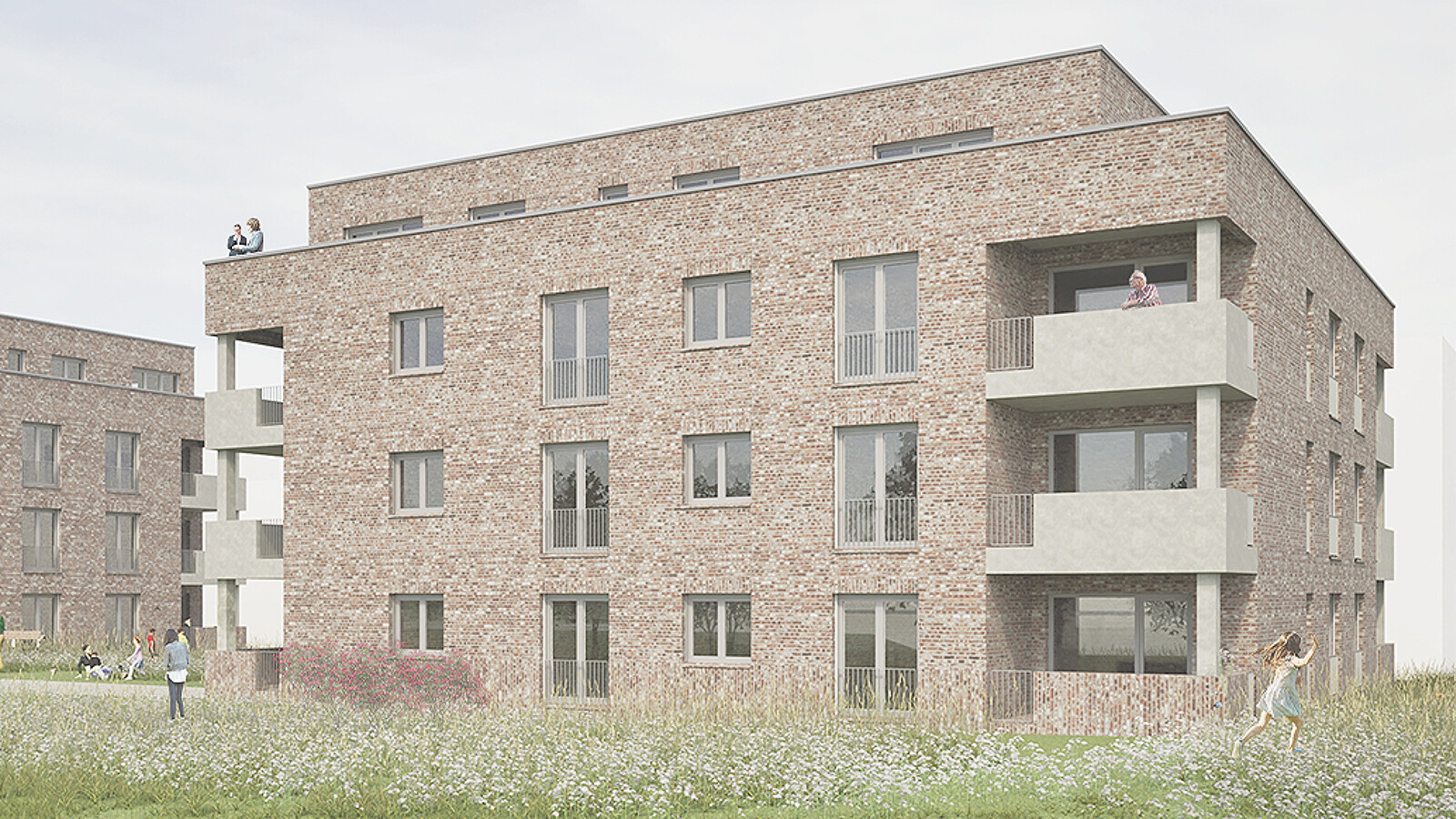 Ansicht eines Mehrfamilienhauses mit Balkonen an den Ecken.